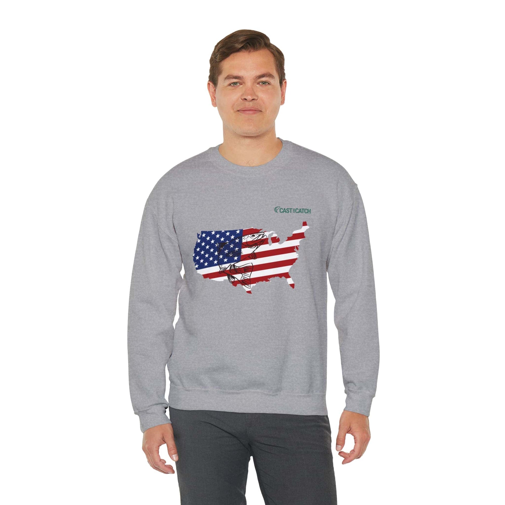 Fishing hooded sweatshirt color gray, context male model wearing sweatshirt. Front designed with the State's Silhouette in US flag colors, with a black Salmon fish print on it. Brand logo in Plankton Green above the design, on the left side.